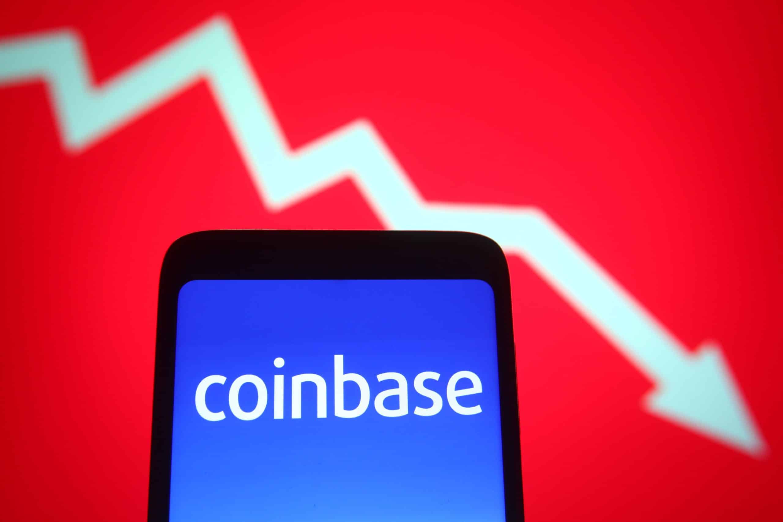 Coinbase logo on a phone with a stock chart background